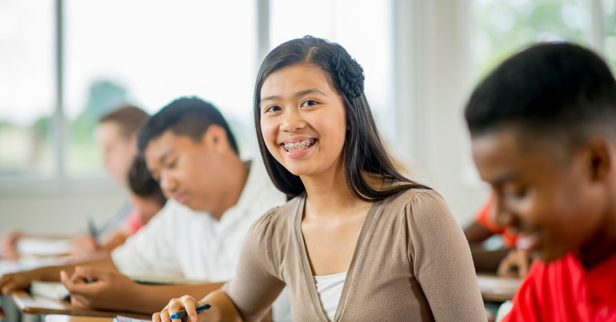 A student smiling in class